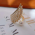 The Pearlescent Angel Wing Statement Ring