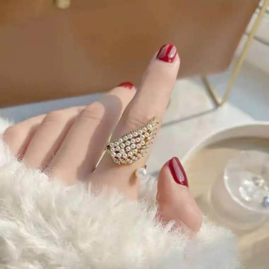 The Pearlescent Angel Wing Statement Ring