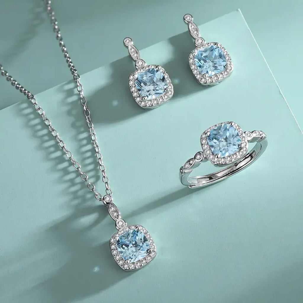 The Ice-Blue Cushion Halo Jewelry Set